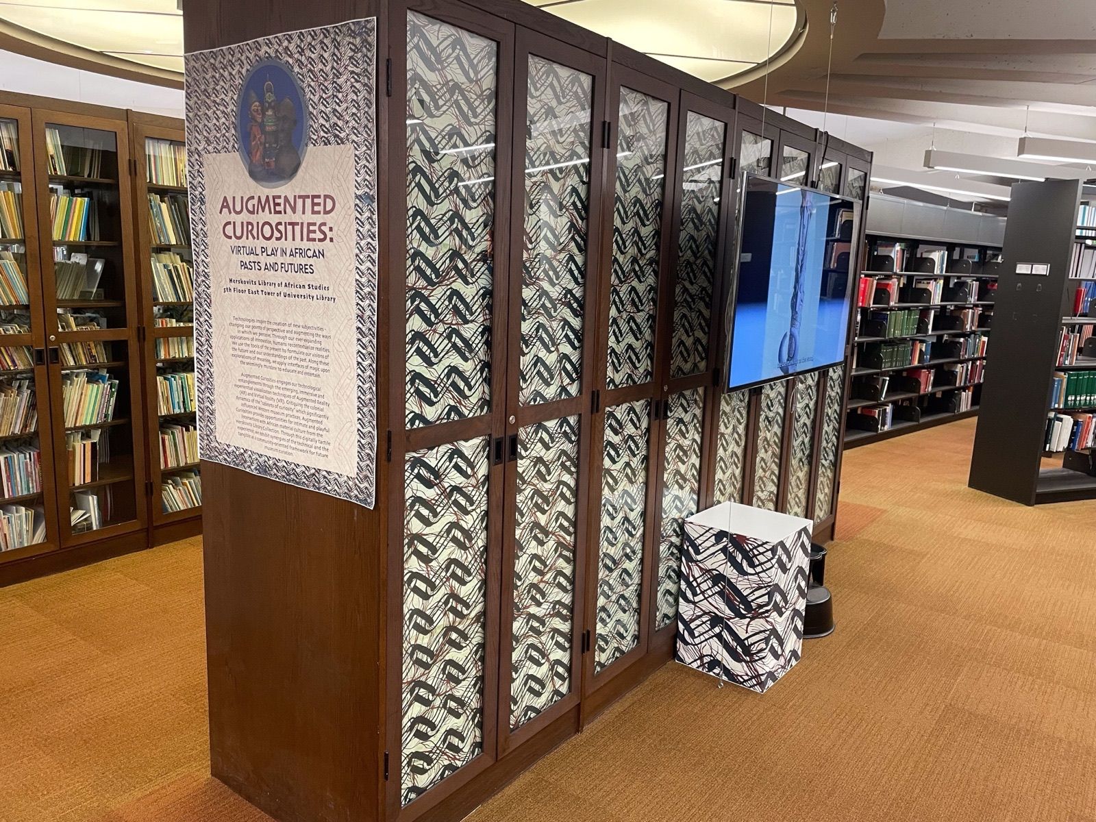 Display cabinet and interpretive media from the Augmented Curiosities exhibition.