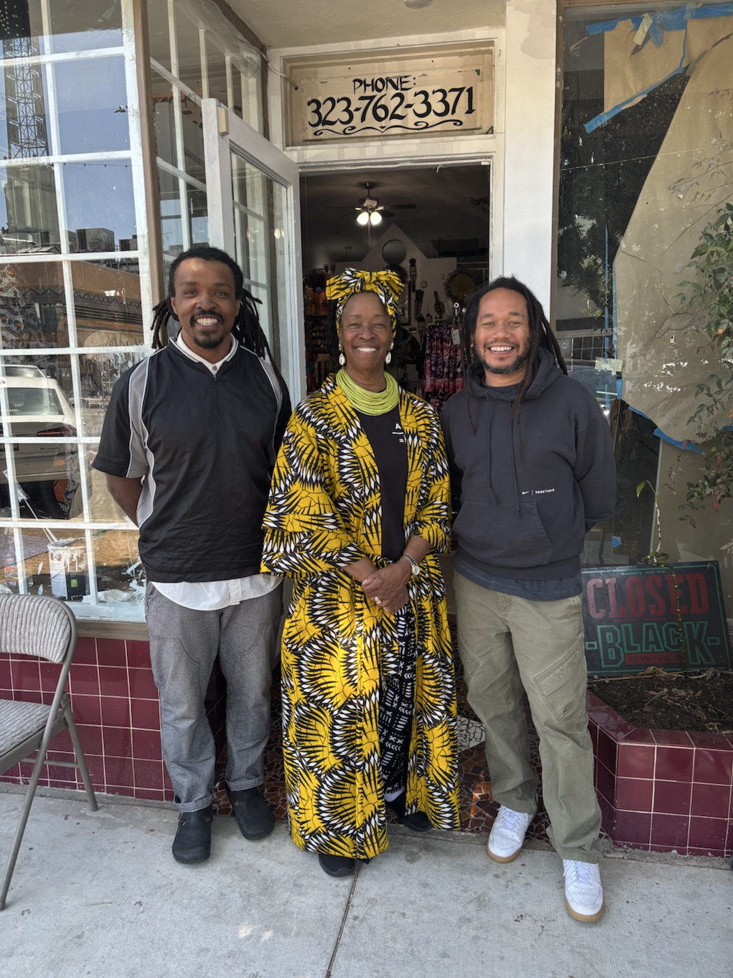 Justin Dunnavant, Queen Aminah, and Craig Stevens outside the Leimert Park collection space.